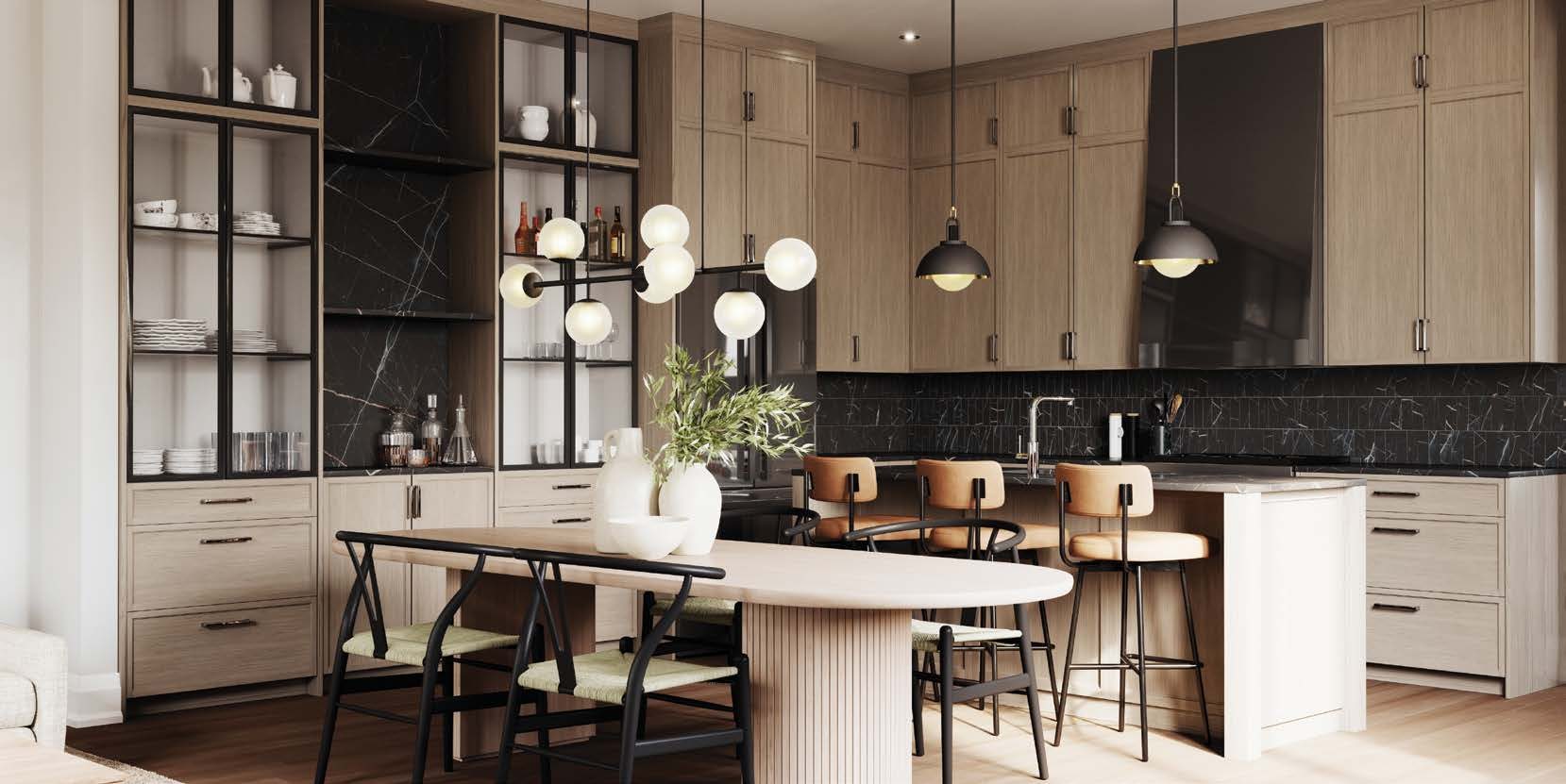 Designer kitchen with oak cabinetry, black marble backsplash and island seating